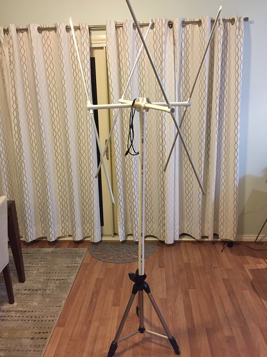 My 137MHz double cross antenna, standing atop a camera tripod in my living room.